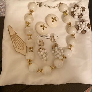 Three earrings, necklace and a broach